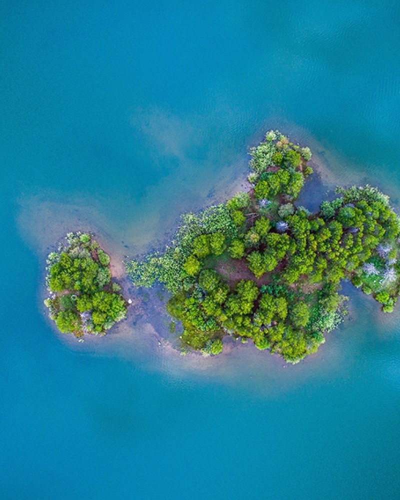 Drone picture of a small, green island